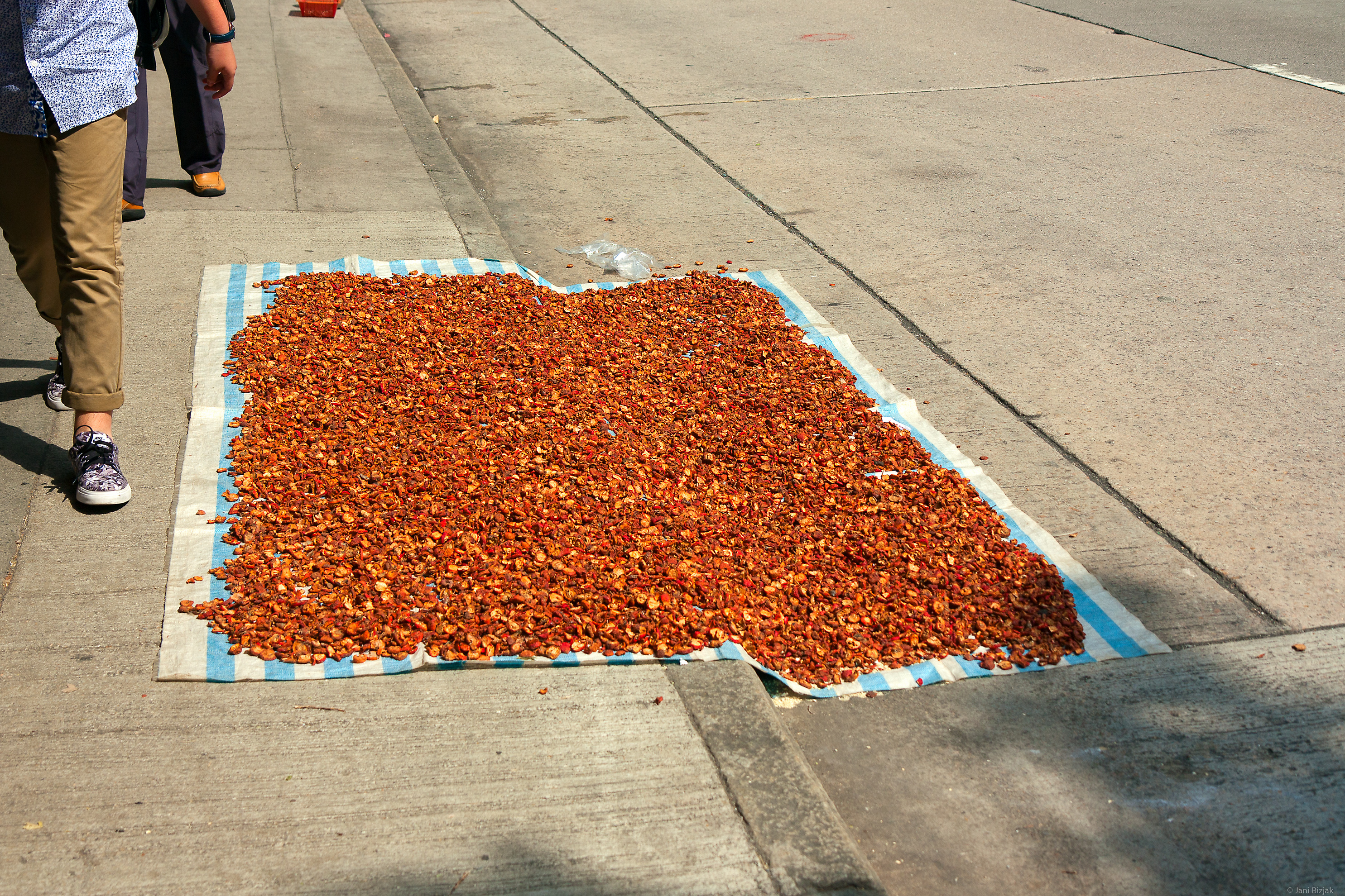 Someone drying spices on the street