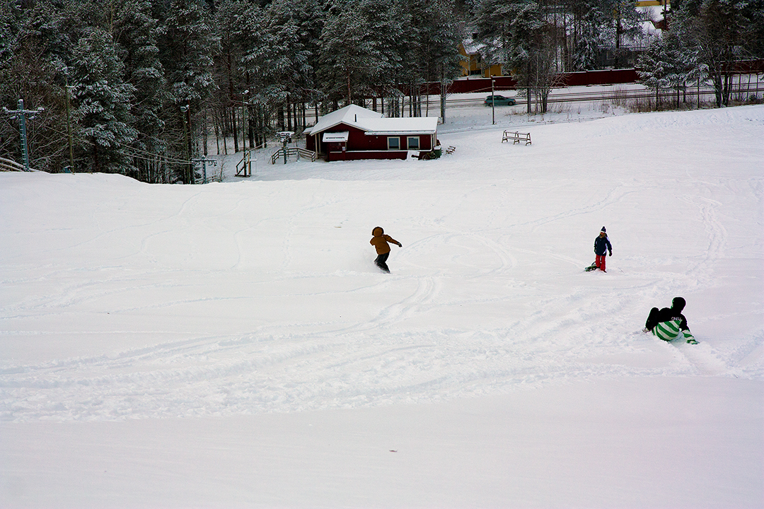 Snow sledding from the highest hill in Luleå