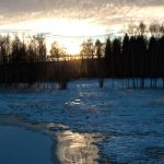 Sunset over the frozen lake