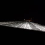 Highway in northern Sweden, full of snow and dark for most of the time.