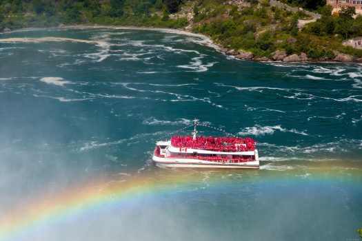 Boat drives literary below the fall.