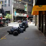 Trash bags in the middle of the street