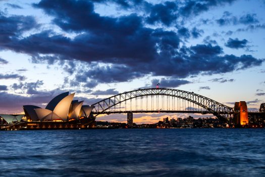 Sydney opera and Harbour bridge at dusk.