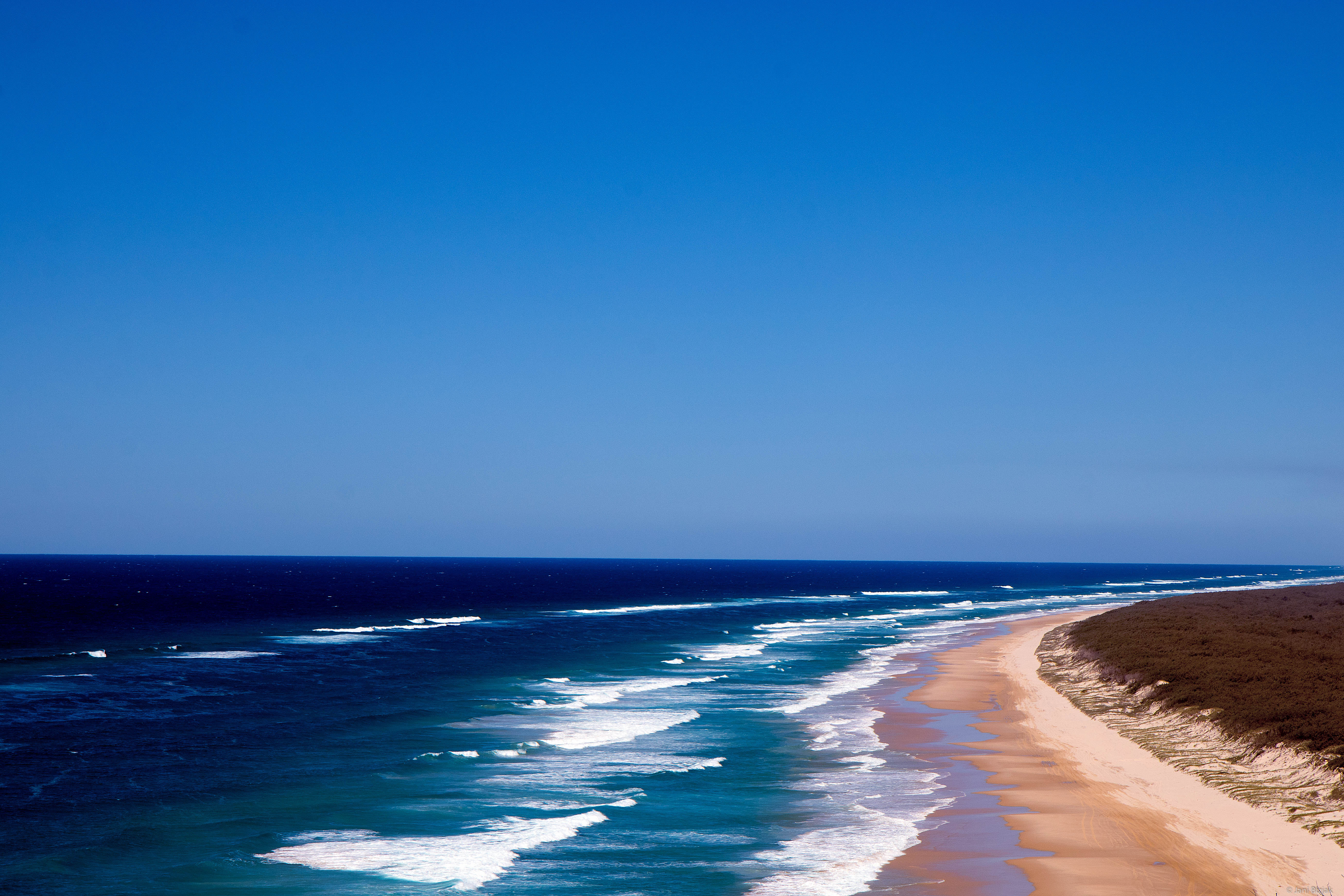 Sandy beach that stretches all around the island